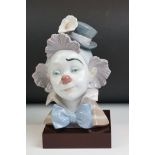 Lladro ' Star Struck ' porcelain clown bust figure, model no. 5610, 22cm high, raised on a wooden