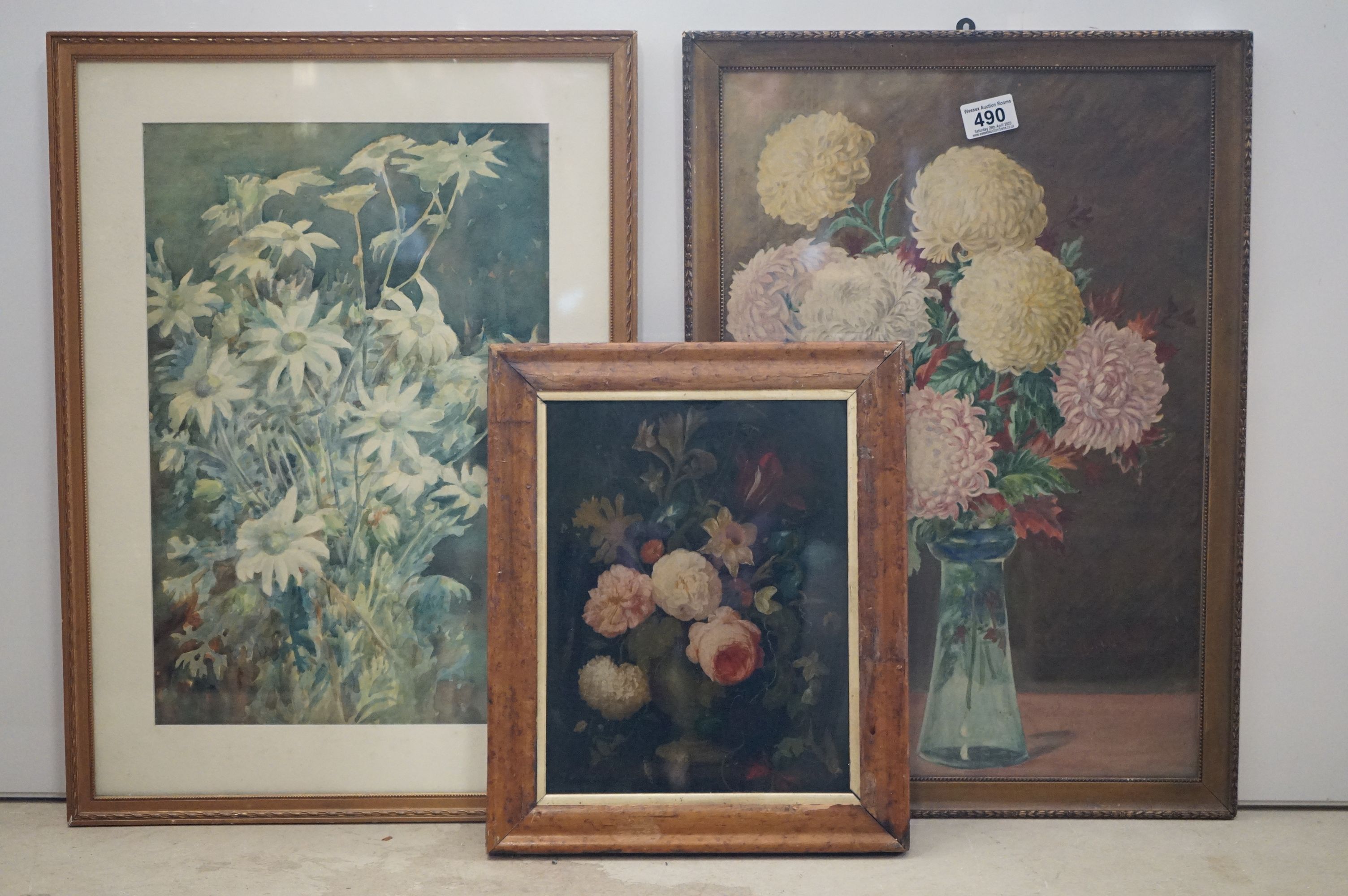 Oil on glass, a still life of flowers in an urn, together with two gilt framed watercolours of
