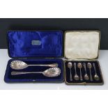 A cased set of six hallmarked sterling silver tea spoons together with a cased pair of fully