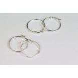 Two pairs of silver hoop earrings