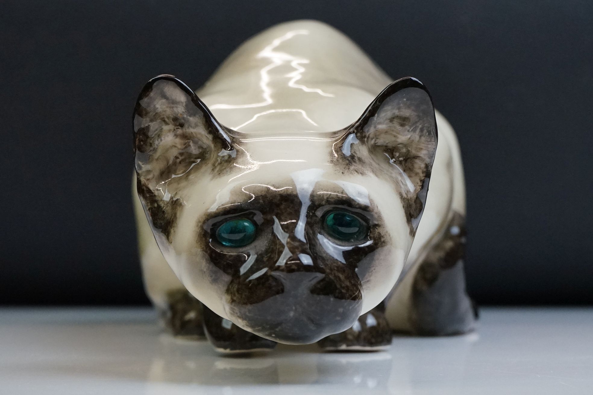 Winstanley pottery figure of a crouching Siamese cat with blue glass eyes, signed to the base and - Image 9 of 14