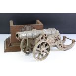 Cast Metal Model of an Artillery Canon, 45cm long together with an Oak Stand carved with the