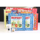 Group of Rupert The Bear related collectables, to include books, mug, poster, Christmas Tree