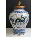 Chinese Porcelain Bulbous Jar decorated in the Wucai palette with dragons, Qianlong four