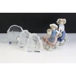 Two Lladro Figures of Girls holding baskets of flowers, 18cm high together with Dartington Crystal '