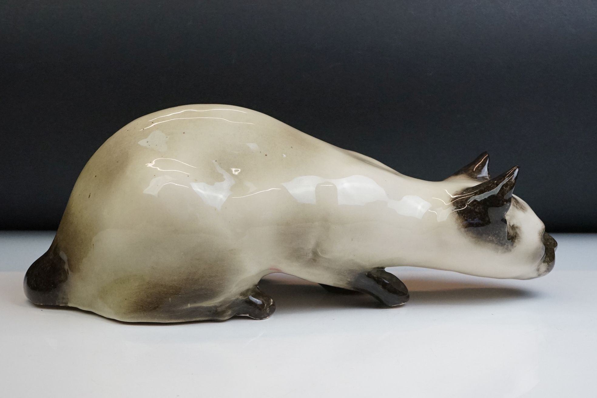 Winstanley pottery figure of a crouching Siamese cat with blue glass eyes, signed to the base and - Image 5 of 14