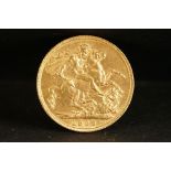 A United Kingdom King Edward VII gold full sovereign coin dated 1909.