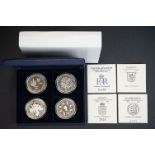 A collection of four United Kingdom silver proof coronation anniversary crown coins, to include