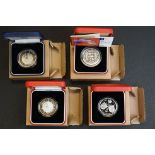 A collection of four Royal Mint United Kingdom silver proof crown and £5 coins to include the 2000