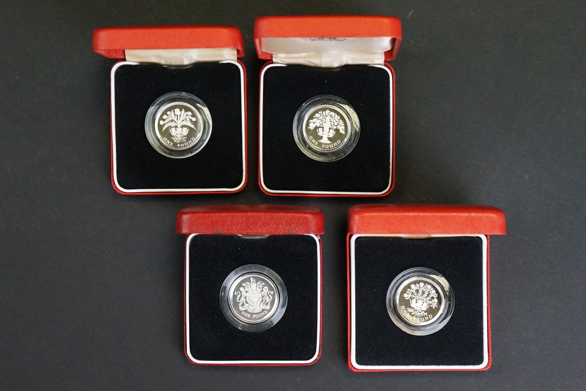 A collection of four Royal Mint United Kingdom silver proof £1 / one pound coins to include 1986,