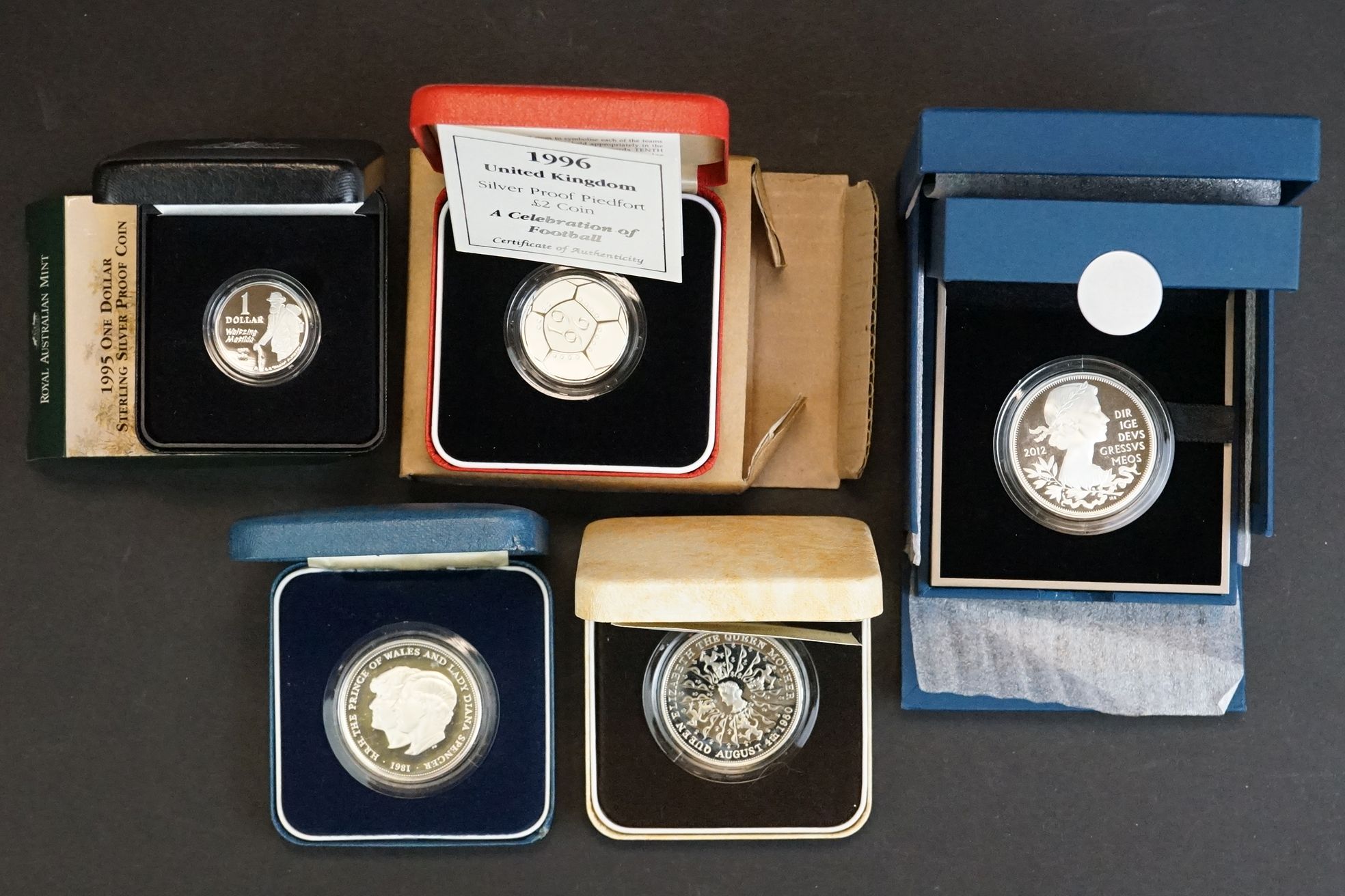 A collection of five cased silver proof coins to include the 2012 Queens Diamond Jubilee crown, 1995