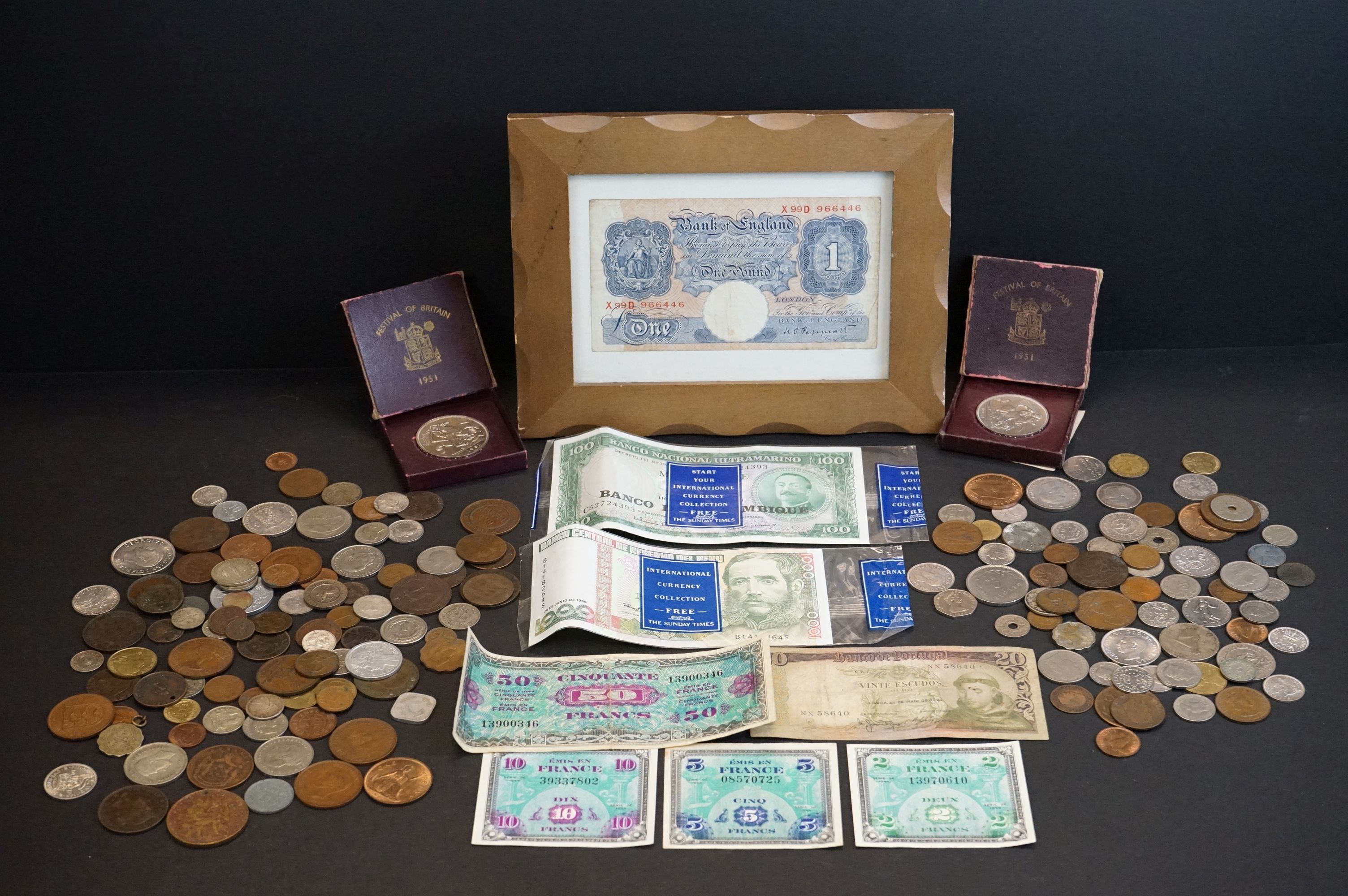 A small collection of British and foreign coins and banknotes to include commemorative crowns, pre