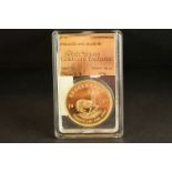 A slab mounted South Africa gold 1oz full Krugerrand coin dated 1977.