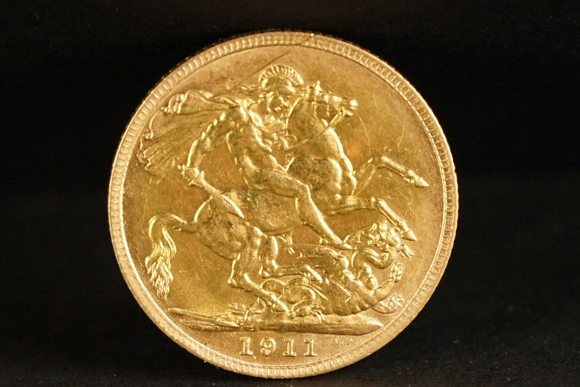 A United Kingdom King George V gold full sovereign coin dated 1911.