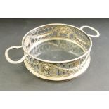 George III silver twin handled bottle coaster, pierced frame, swag and garland decoration, flower