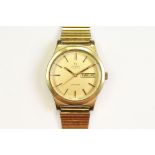 A vintage gents Swiss made Omega Geneve automatic wristwatch, day & date function to 3pm, omega logo
