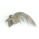 Marcasite white metal exotic bird brooch, the body, wings and tail feathers set with rose cut