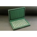 A cased set of 100 x 925 sterling silver Motor Car ingots within a fitted green presentation case,