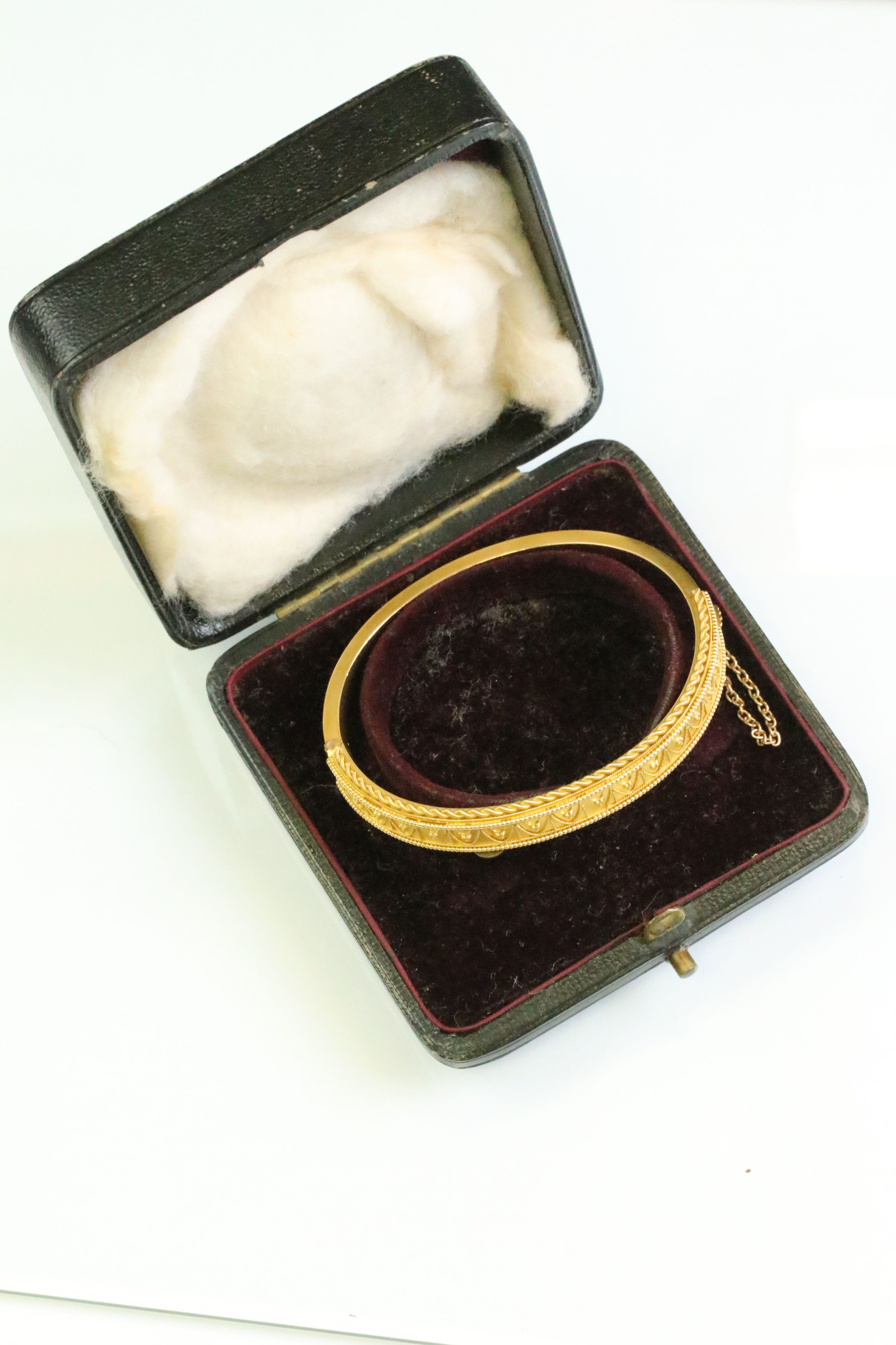 Victorian Etruscan revival 15ct yellow gold hinged bangle, rope twist and granulation detailing,