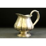 Russian silver cream jug raised on stepped circular foot, ribbed body, makers mark AM, height approx