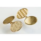 Pair of 9ct yellow gold oval panel chain link cufflinks, one plain polished panel and one engraved