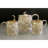 Late 19th century three piece silver tea service comprising teapot, milk jug and sugar bowl, heavily