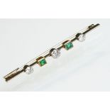 Art Deco diamond and green stone unmarked white and yellow gold bar brooch, the knife edge design