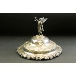 Mid 19th century domed lid with winged maiden finial and cast grape and vine leaf border, makers