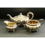 William IV three piece silver tea service comprising teapot, milk jug and sugar bowl, the squat