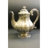 William IV silver coffee pot, baluster form raised on pie crust foot, the scroll handle with cast