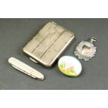 Silver cigarette case, length approx 6cm, silver cased folding penknife, silver medallion and a