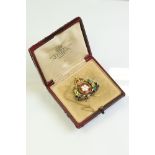 Early 20th century enamelled Derbyshire Imperial Yeomanry unmarked yellow gold brooch, the wreath