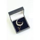 19th century diamond unmarked yellow and rose gold silver set crescent brooch, seventeen graduated
