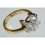 Diamond solitaire 18ct yellow and white gold set ring, the round brilliant cut diamond weighing