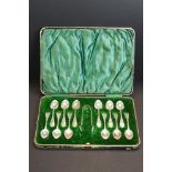 Edwardian cased set of twelve silver coffee spoons and a pair of matching sugar tongs, bead