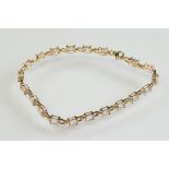 Morganite 10ct yellow gold line bracelet, twenty oval mixed cut morganite, dimensions approx 6mm x