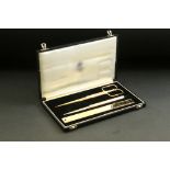 Asprey gilt desk set in original fitted case comprising rule, paper knife and a pair of scissors,