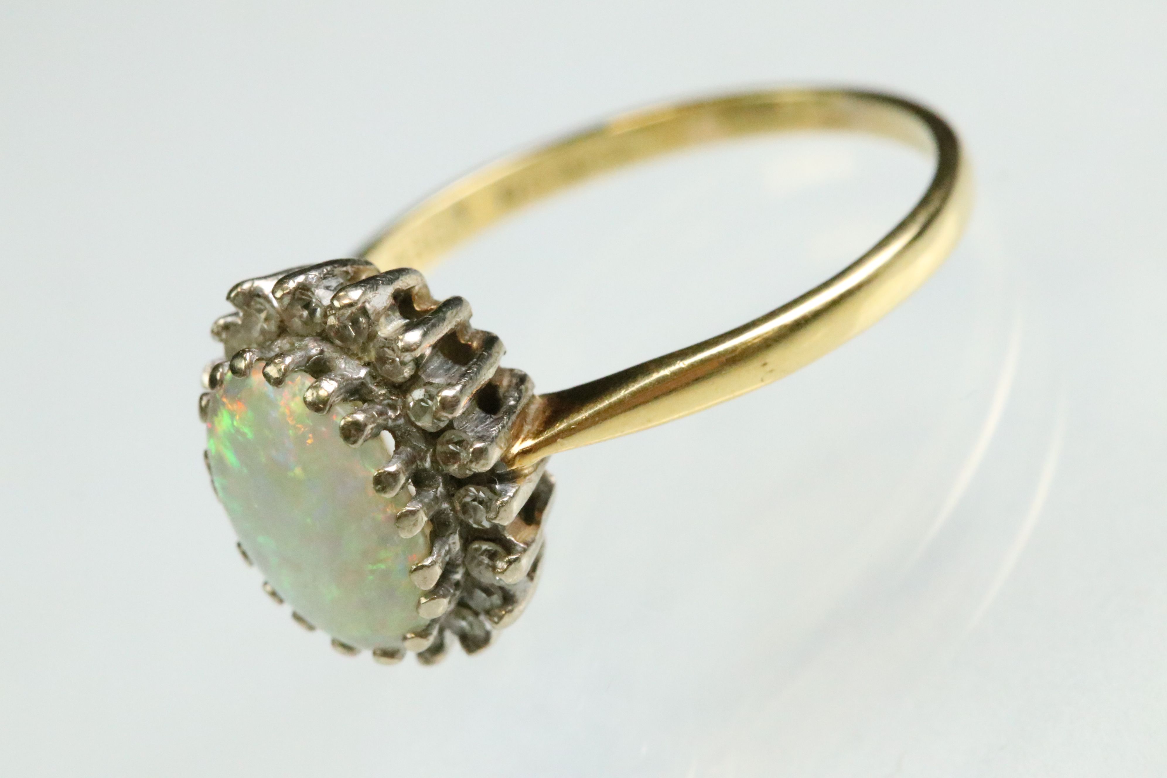 Opal and diamond 18ct yellow and white gold set cluster ring, the precious white opal displaying - Image 2 of 7