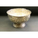 Late Victorian silver punch bowl, repoussé floral and foliate scroll decoration, one monogrammed
