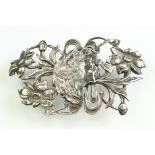 Art Nouveau silver buckle, repoussé and cast female head and floral design, makers William