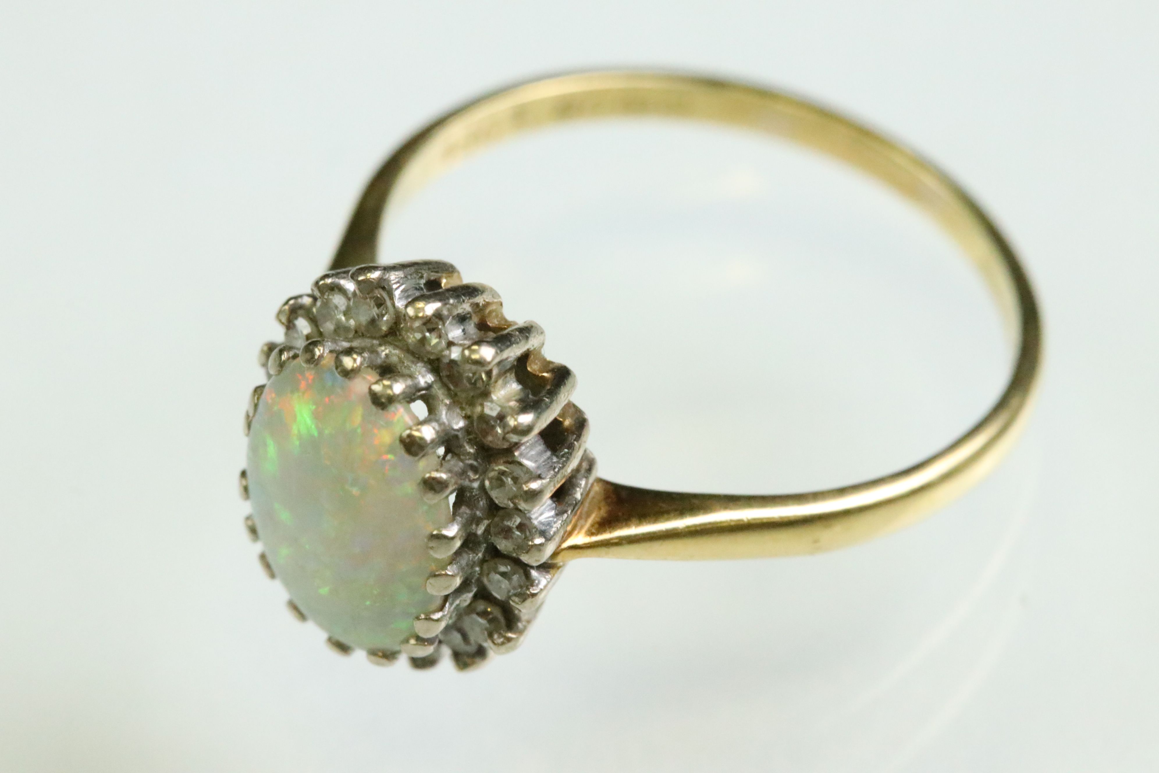 Opal and diamond 18ct yellow and white gold set cluster ring, the precious white opal displaying - Image 5 of 7
