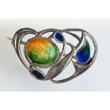 Archibald Knox for Liberty & Co Cymric enamelled silver brooch, the sinuous entwined design with