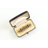 Victorian lapis lazuli yellow metal brooch, three rectangular cabochon cut and four round cabochon