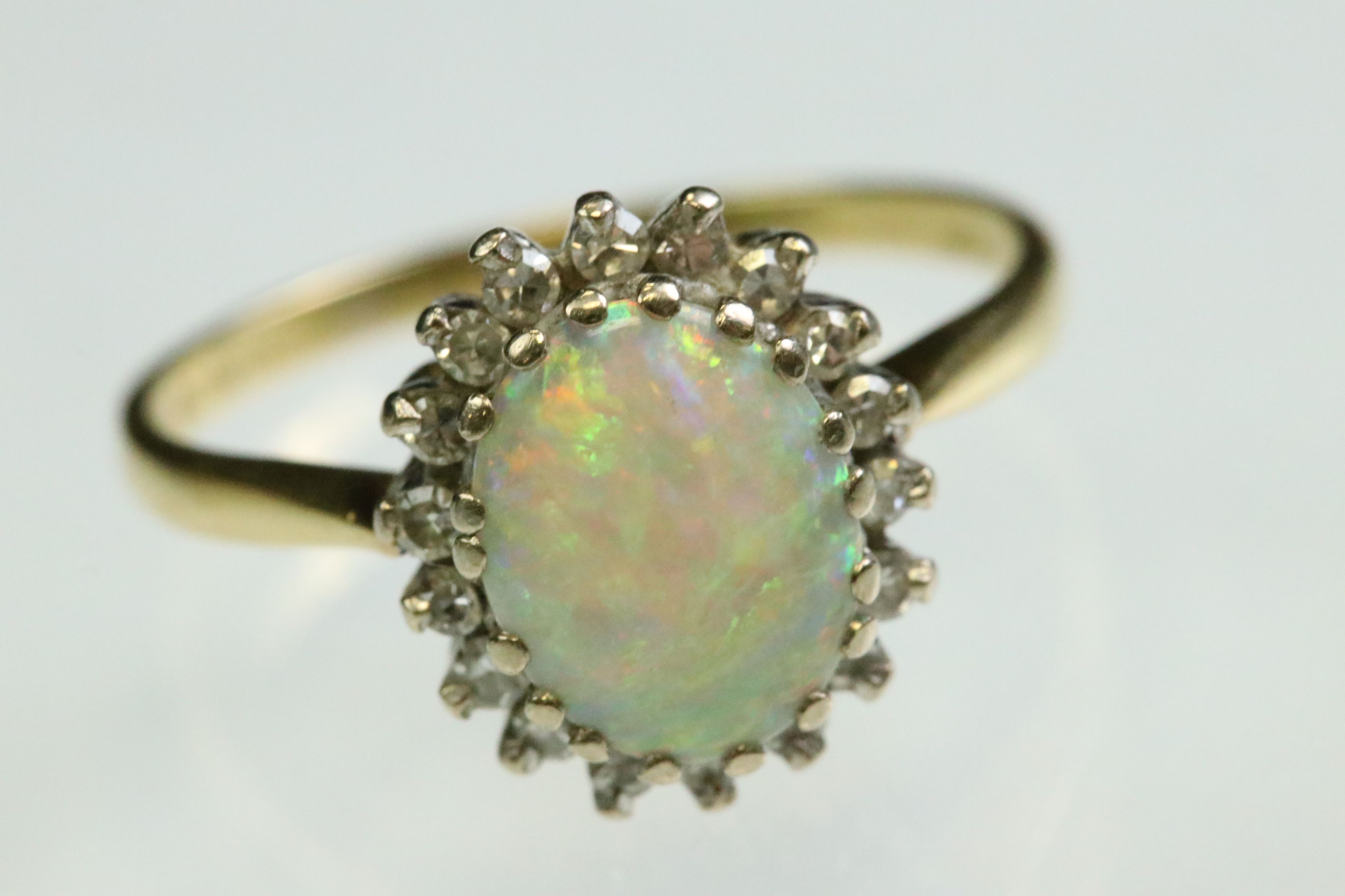Opal and diamond 18ct yellow and white gold set cluster ring, the precious white opal displaying - Image 3 of 7