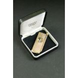 9ct gold cased cigar cutter, engine turned decoration