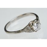 Diamond solitaire white metal ring, the round brilliant cut diamond weighing approx 0.50 carat,