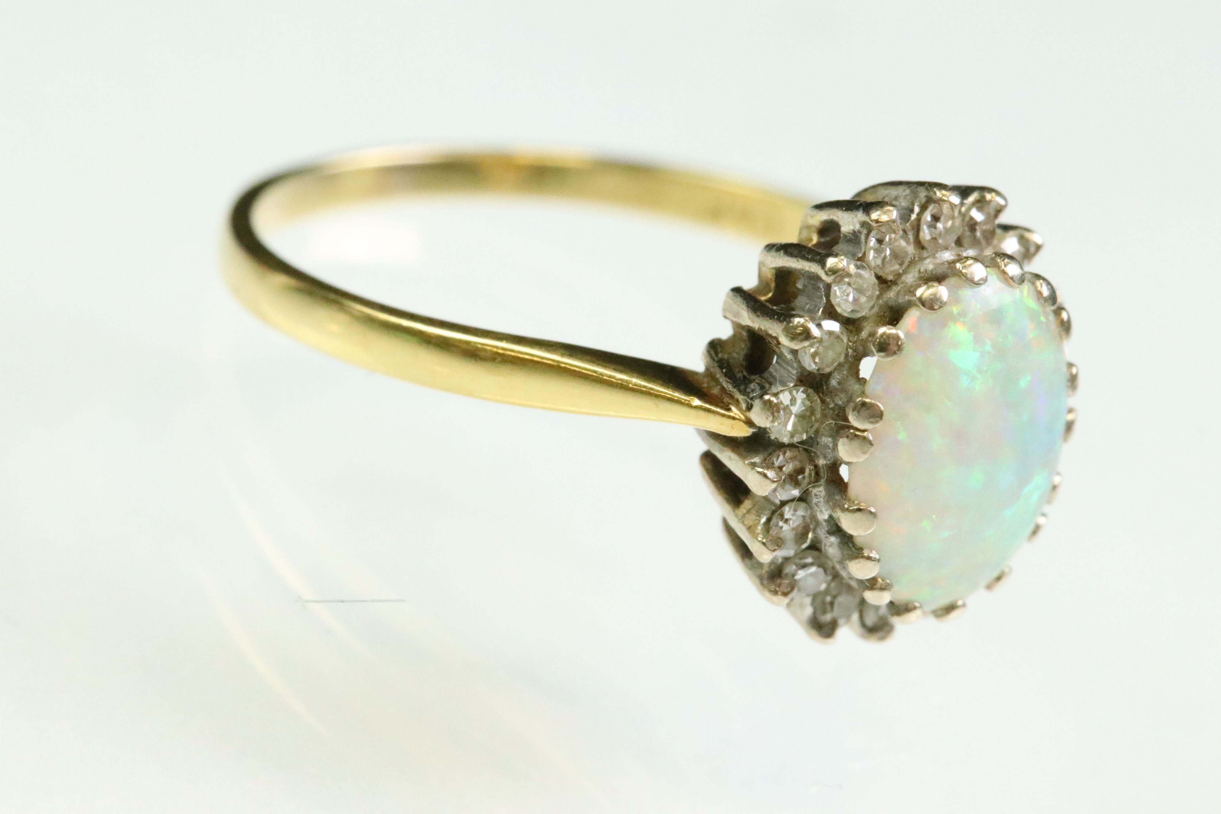 Opal and diamond 18ct yellow and white gold set cluster ring, the precious white opal displaying - Image 4 of 7