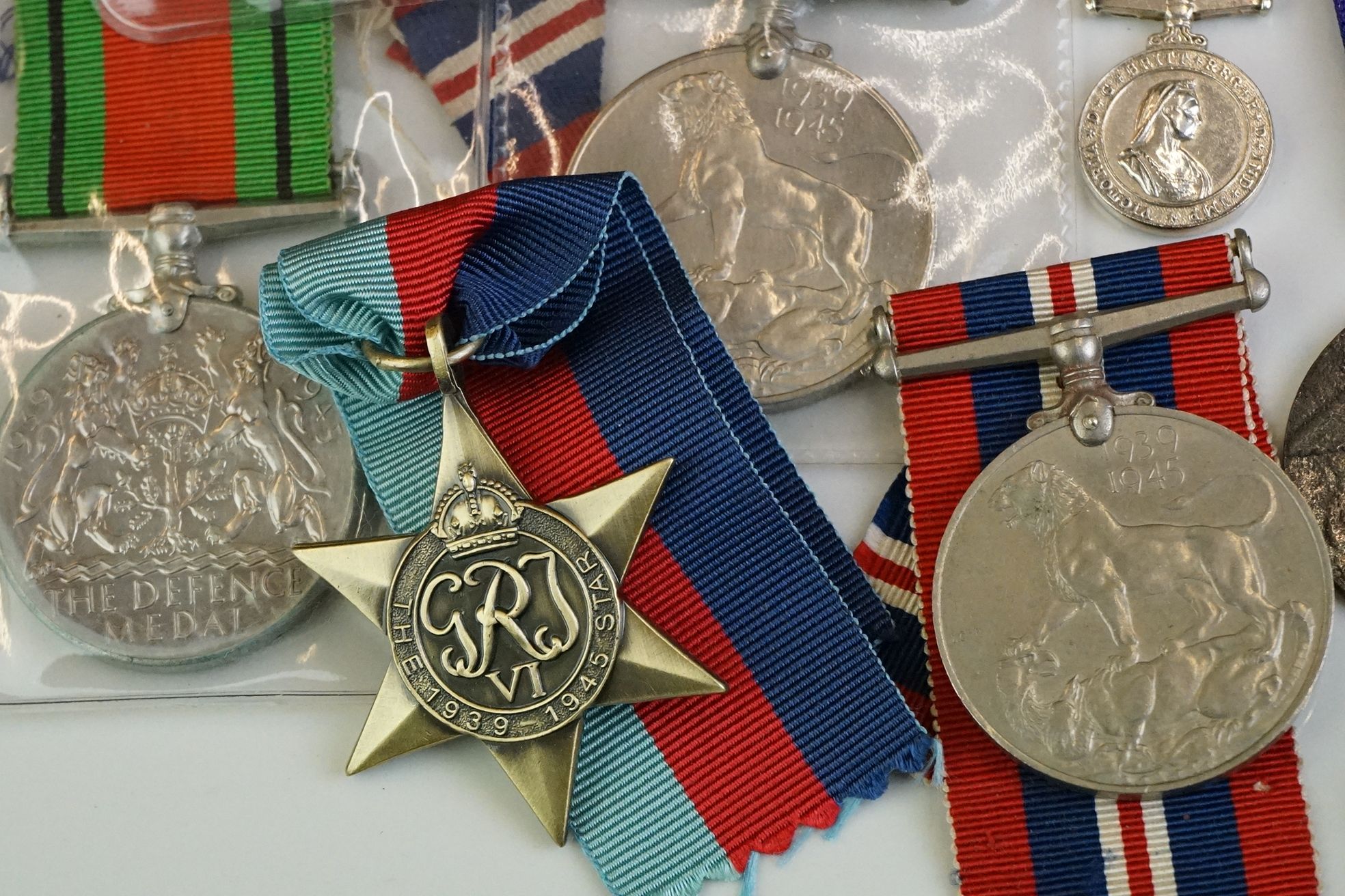 A group of military collectables to include a framed set of Royal Army Ordnance corps badges, a - Image 7 of 15