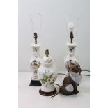 Three ceramic lamp bases with floral and bird decoration together with a outdoor fox ornament.