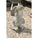 Reconstituted stone Garden figure of Putti holding Fish, 73cm high